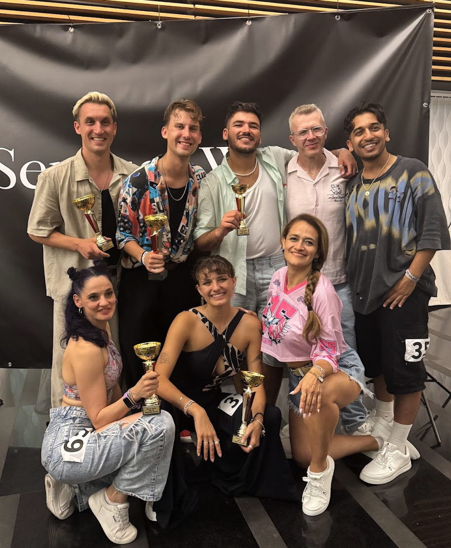 Participants and winners holding trophies during the 2025 event